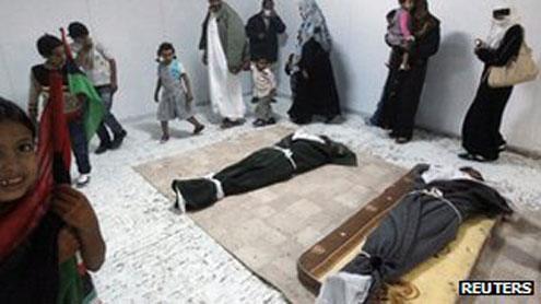 The bodies of Col Gaddafi, Muatassim and former defence minister Abu Bakr Younis Jabr, before they were buried early this morning. Photo: Reuters