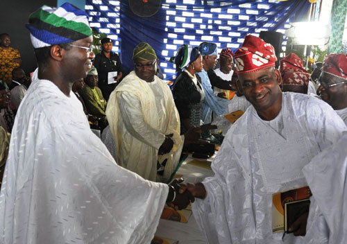 Lagos State Governor, Mr. Babatunde Fashola SAN (left) congratulating the elected Chairman of Itire-Ikate of Local Council Development Area, Hon. Hakeem  Bamgbola (right) after being sworn in during the swearing-in ceremony of the elected Chairmen of the 20 Local Governments and the 37 Local Council Development Areas in Lagos at the Blue Roof, Lagos Television Agidingbi, Ikeja, Lagos on Saturday, October 29, 2011.