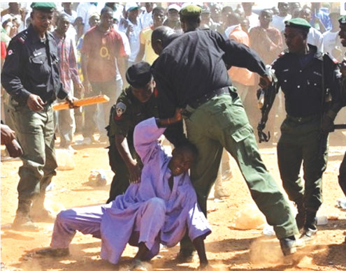 What they enjoy doing: Nigerian policemen  brutalising a teenager.