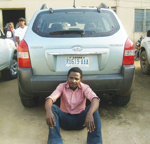 Beautiful One, the ex-UNILAG cultist with the SUV he allegedly stole. PHOTO: AYODEJI DEDEIGBO.