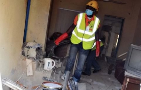 Anti-bomb squads clean up a Boko haram bomb factory shortly after it exploded