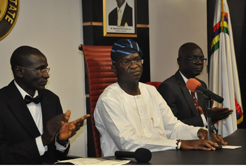Lagos State Governor, Mr. Babatunde Fashola SAN (middle), flanked by the Chairman, Nigeria Bar Association (NBA), Ikeja Branch, Mr. Adebamigbe Omole (left) and the Attorney-General and Commissioner for Justice, Mr. Ade Ipaye (right) during the presentation of a letter of protest against the deployment of troops in Lagos to the Governor at the State House, Ikeja, on Friday, January 20, 2012.