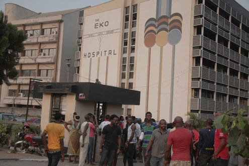 People at the entrance of the Eko Hospital that was gutted by fire.