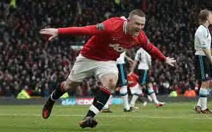 Flying Wayne Rooney scored two goals to give Man United 2-1 victory against Liverpool in their EPL match on Saturday.