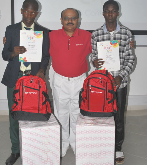 •MD, Toyota (Nigeria) Limited Mr. Chandrasheker Thampy flanked by national winners of the contest, Wesey Joshua Oyeoluwaniyi and Bankole Olabode at the Art Contest.