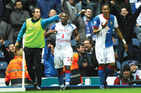 Wearing a T-shirt in support of Bolton Wanderers’ Fabrice Muamba, Blackburn Rovers’ Nigerian forward Yakubu Aiyegbeni (2nd l)celebrates scoring a goal during their EPL match at Ewood Park yesterday. Blackburn won 2-0.PHOTO: AFP.