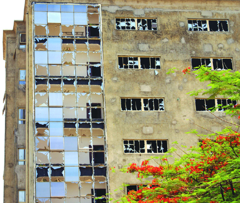 One of the buildings seriouly damaged by the bomb blast at ThisDay office in Abuja, yesterday. PHOTO: FEMI IPAYE.