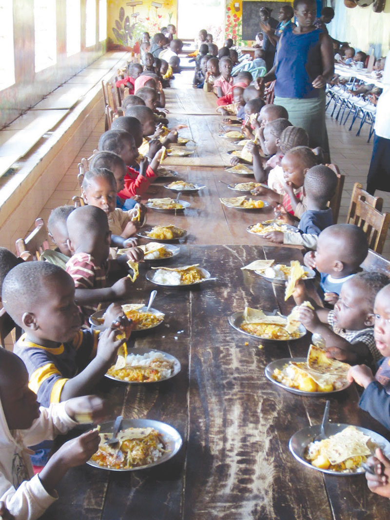 Abandoned children in an orphanage having their meal.