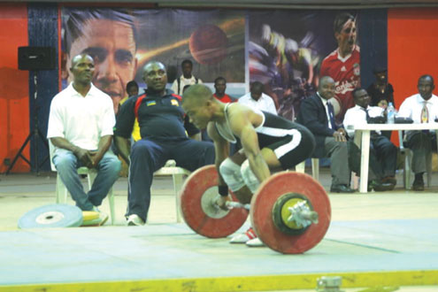 •A weight lifter during a weightlifting tourney.