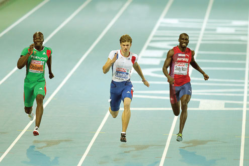 Nigerian born Francis Obikwelu of Portugal (l) in action during a recent athletics meet.