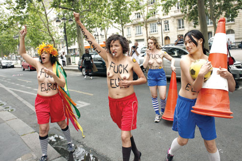 •ALL FOR WOMEN…French members of Ukrainian feminist group ‘Femen’ protest against prostitution during the Euro 2012 football championships in front of the Ukrainian Embassy in Paris on 1 June, 2012. The protest was held to oppose the staging of the Euro 2012 in Ukraine a week ahead of the event. AFP PHOTO