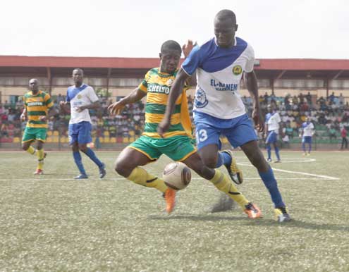 Wasoomo Desire of El-Kanemi (r) fights for the ball with Ogar Vincent of Kwara United during their Fed Cup opening match at the Agege stadium, Lagos on Monday. Photo: Emma Osodi.