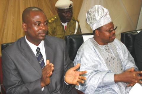 The author Dr. Martin Agwogie and NDLEA DG Mr. Femi Ajayi at the presentation