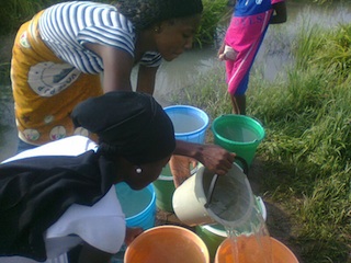 2 Keffii residents fetching water from stream