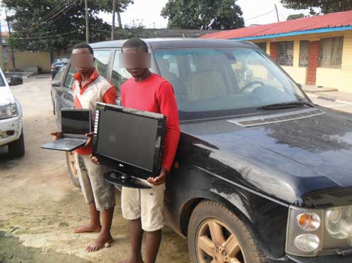 Obinna Sunday and Sunday Eze with the SUV and other items they allegedly stole.