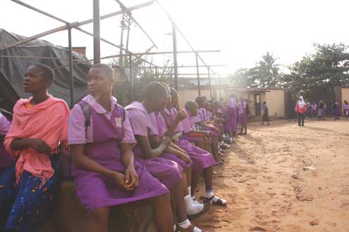 Student of Ikosi Junior High school sitting outside their classrooms today following the strike by their teachers. Photo: Emmanuel Osodi