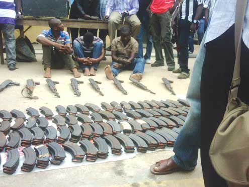 The suspects and weapons recovered from them.