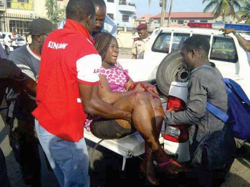 A female okada passenger being taken to the hospital after suffering a broken arm in an accident on Agidingbi Road on Saturday