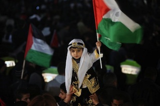 A flag waving Palestinian kid after UN vote