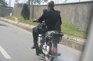 a policeman riding his bike against the law