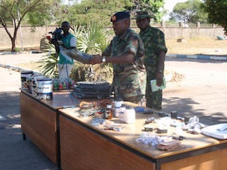 Colonel Kukasheka Usman displays the seized items