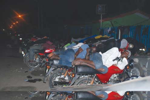 Okada riders enjoying their sleep under the flyover at Obalende. Photo: Abeeb Ogunbadejo.