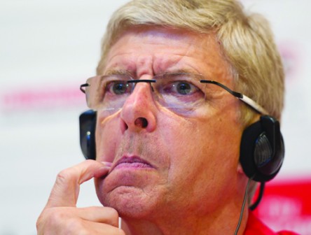 Arsene Wenger: faces the press on woeful outing