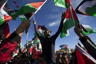 Flag waving Palestinians celebrate new national status