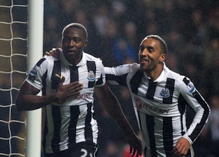 Shola Ameobi with team mate