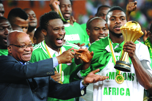 Celebration ... Super Eagles' captian, Joseph Yobo (right) celebrates with the Africa Cup of Nations trophy after Nigeria defeated Burkina Faso 1-0 in the final yesterday in South Africa. Photo: AFP
