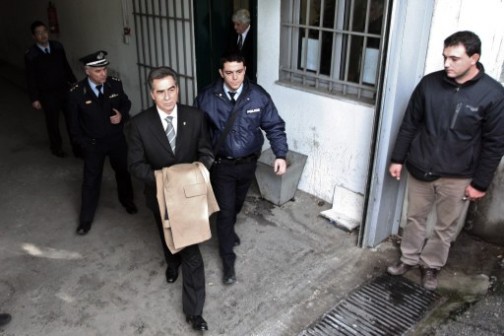 Vassilis Papageorgopoulos, left being escorted to prison