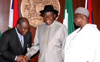 Goodluck congratulates Nebo. Turaki looks on