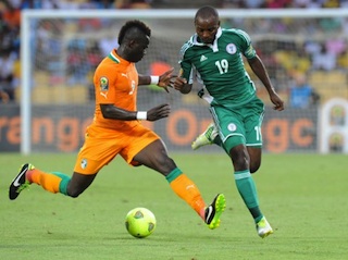 Mba on the ball against Tiote of Ivory Coast