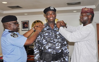 Odumosu being decorated with new rank of assistant commissioner of police