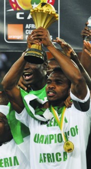Super Eagles captain, Yobo with the trophy