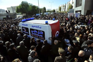 Tunisians surround belaid's ambulance