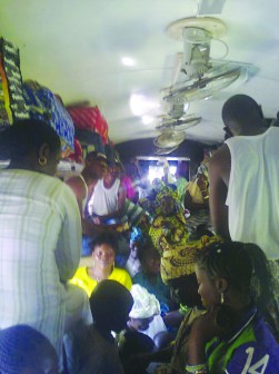 An overcrowded interior section of the train