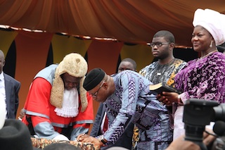 Mimiko signing the oath book