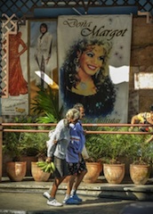 Havana: 2 elderly woman walk past a night club
