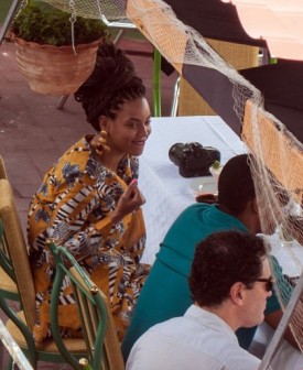 US singer Beyonce is seen in a private restaurant in Havana, next to her husband Jay Z (green shirt), on April 4, 2013.     AFP 