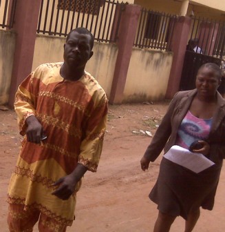 The landlord being arrested by a police officer