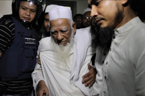 Bundled out:Bangladeshi police escort Hefajat-e-Islam movement veteran leader Allama Shah Ahmad Shafi (C) from a madrassa in Dhaka on May 6, 2013. 