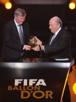Ferguson receiving presidential award from Blatter in 2012