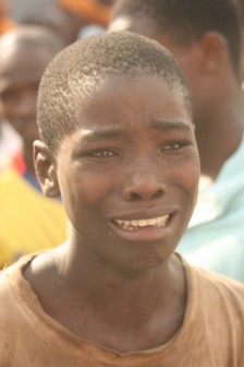 Lucky escape: a boy sent on errand before the collapse burst into tears. Photo: Joseph Oluwasanmi