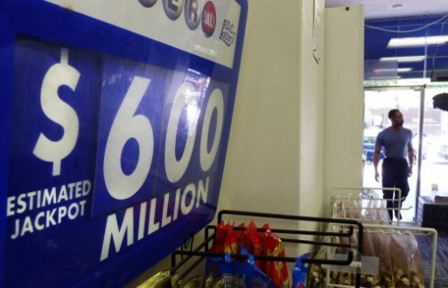 An advertising board showing the record jackpot of the Powerball US lottery with a record jackpot of 600 million US Dollars in a shop in downtown Washington, DC on May 17, 2013.  