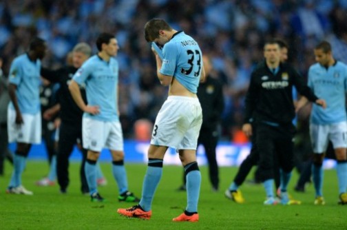 Dejected Man City players at the end of the match. AFP