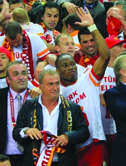 CELEBRATION...Galatasaray players, head coach Fatih Terim (centre) and Ivorian forward Didier Drogba (right) celebrate their victory yesterday at Turk Telekom Arena, in Istanbul to claim their 19th Spor Toto Super League title with a victory over Sivasspor. PHOTO: AFP.