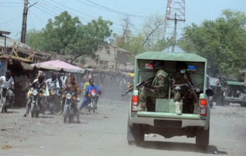 File photo: soldiers on patrol in Maiduguri.: emergency rule has not stemmed Boko Haram attacks. AFP