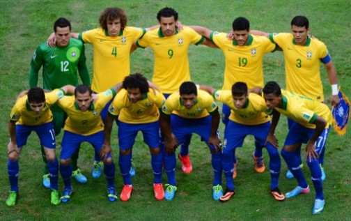 The Brazilian national football team poses before the start of the FIFA Confederations Cup Brazil 2013 Group A football match against Japan, at the National Stadium in Brasilia on June 15, 2013. (First row, L-R) Forward Oscar, defender Dani Alves, defender  Marcelo, midfielder Paulinho, forward Neymar and midfielder Luiz Gustavo. (Standing, L-R) Goalkeeper Julio Cesar, defender David Luiz, forward Fred, forward Hulk and defender Thiago Silva.     AFP 