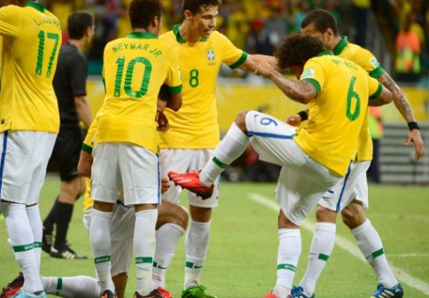 Brazilian forward Fred simulates polishing Marcelo's boot after a pass for  a goal. AFP